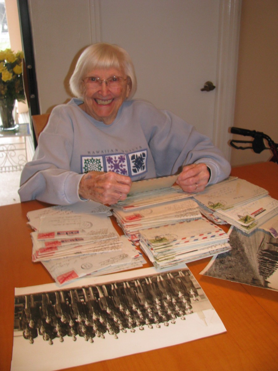 Marcella Zaborac looks at a table full of letters from John, her late husband, sent her while he was recovering from injuries sustained stateside while flying as a radio operator in a B-24 bomber during World War II and she was serving as a nurse in the Army Nurse Corps in Europe