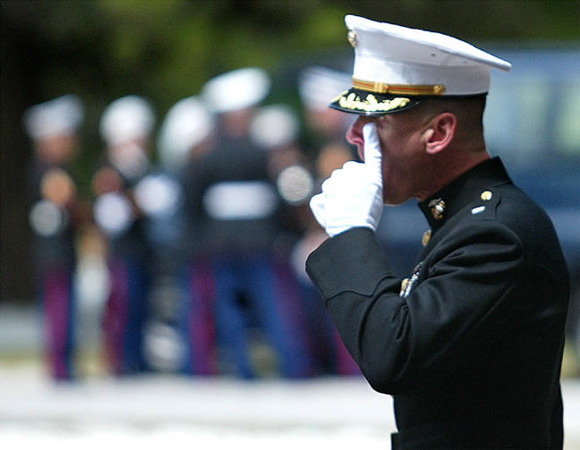 Marine Lt. Col. James Beaty, commanding the funeral detail, wipes a tear from his eye with a white-gloved finger. Sun photo by Jeffery Langlois 