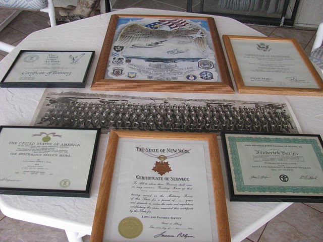 A table full of awards he received during his 37 years of service in the United States Air Force are pictured. Included in these awards is a Meritorious Service Award from President Bill Clinton. Sun photo by Don Moore