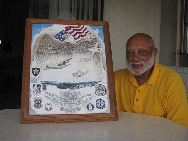 Former MSgt. Fred Burger of Prairie Creek subdivision east of Punta Gorda looks at a poster he made of the planes and helicopters he repaired in the units he served in. Among the engines he services were ones for F-102 fighters, KC-97 tankers, C-119 Flying Box Cars, and a variety of helicopters. Sun photo by Don Moore
