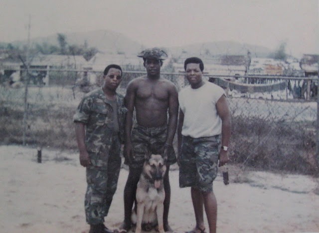Cpl Joe Taylor, center, and two of his buddies in Vietnam with a bomb-sniffing police dog. Taylor served with Delta Company, 1st Battalion, 26th Marine Regiment, 4th Marine Division in the 1960s. Photo provided.