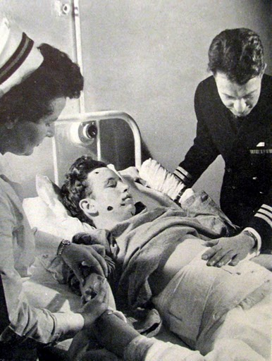 Lt. j.g. Millie Edsall works with a Navy doctor at the Royal Victoria Hospital in England to save the life of a young sailor who was seriously injured when a German land mine he was handling exploded. Photo provided