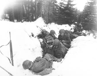 Members of the 2nd Infantry Division struggle to survive in the snow during the Battle of the Bulge. It was the largest battle on the Western Front in World War II. Photo provided