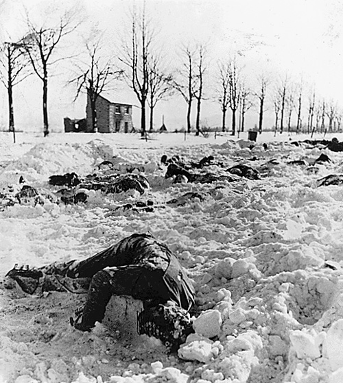 aaa January 1945, executed American POW's bodies are uncovered by US Army personnel in Malmédy, Belgium.