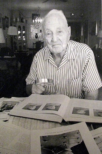 James Stephenson takes a look at his 1929 West Point yearbook. At 93 he is one of West Point's oldest grads. Sun photo by Don Moore