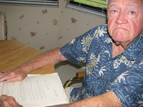 Earl Swillum of Deep Creek pulls out a letter he received from the Secretary of the Navy James Forrestal for his service in World War II. Sun photo by Don Moore