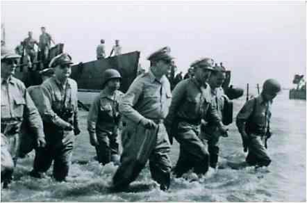 Gen. Douglas MacArthur wades ashore on the beach at Luzon in the Philippines and proclaims "I have returned". Photo provided