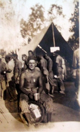 Otto sits astride a beer keg while holding a canteen cup of suds. It was 4th of July 1943 and he and his buddies were celebrating in Townsville, Australia and feeling no pain. Photo provided