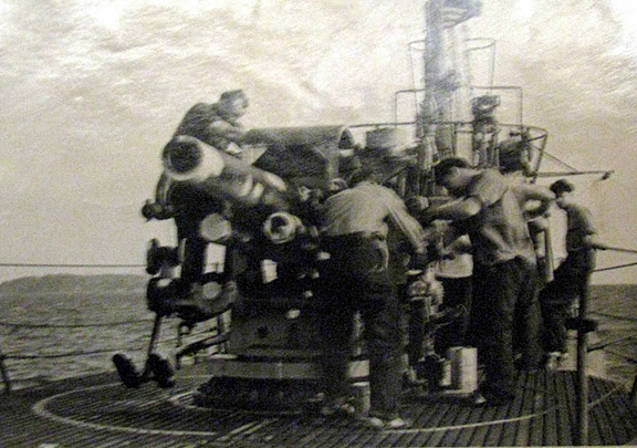 The crew of the submarine, USS Turtta, fires it's deck gun during practice. Photo provided