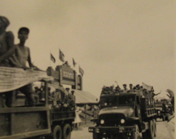 Reaching their final destination the Communist POWs pull up in Army trucks in front of the boarder gate at Panmunjom. Photo provided