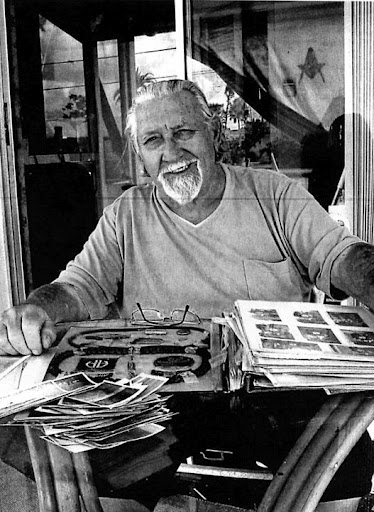 Floyd Gantzer looks at a scrapbook full of memories. He served in the paratroopers during World War II in Europe and fought at the Battle of the Bulge and made a glider attack across the Rhine River during the closing months of the war. Sun photo by Don Moore