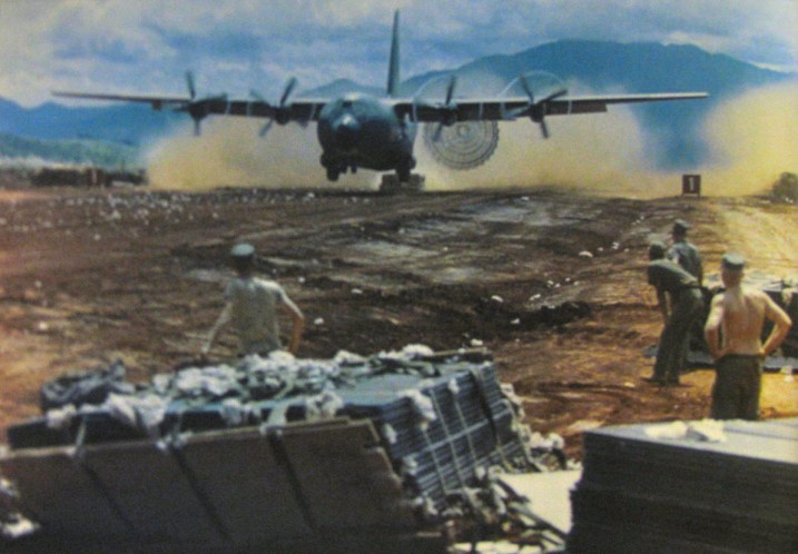 A C-130 transport plane makes a low altitude drop at 180 mph of a skid full of supplies to the U.S. Marine base at Khe Sanh surrounded and under siege by the North Vietnamese Army and the Vietcong in 1967. Photo provided