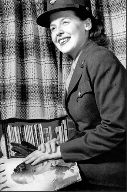 This is an Army publicity picture taken of Winifred Leiser reading “Vogue” magazine during the war. This is one of many the Army took of Leiser to promote the WACS in World War II. 