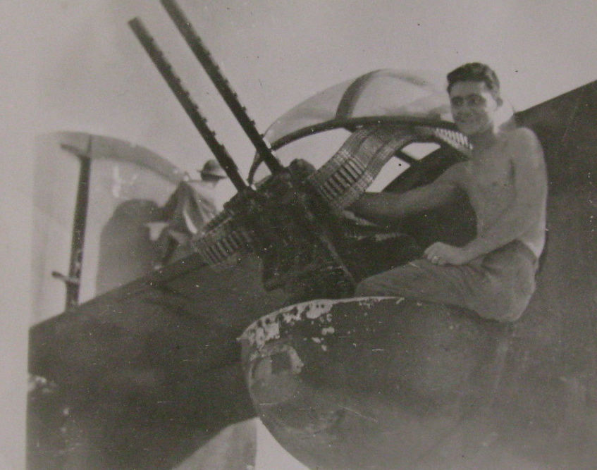 Driver is pictured in the rear turret of his B-24 "Liberator" at his twin .50 caliber machine-guns. Photo provided