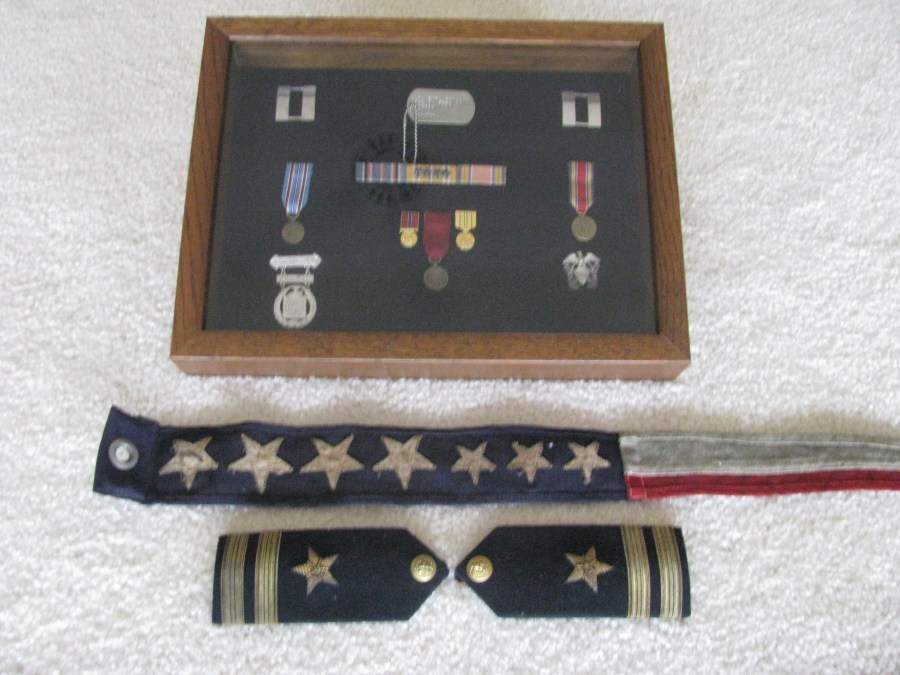  His shadow box has Swillium's Asiatic-Pacific Theatre ribbon with four battle stars for four major conflicts he was in engaged in during the Second World War. He also received a World War II Victory Ribbon and an American Area Campaign Ribbon. His lieutenant's shoulder insignias the ship's pendant his war souvenirs. Sun Photo by Don Moore