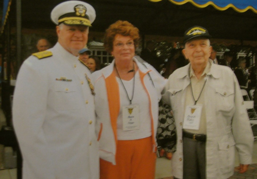  Rohn and his daughter, Marie Anne, talk with Adm. Gary Roughdiad, commanding officer of the U.S. Navy, during Rohn's 70th graduation anniversary at Annapolis in 2010.