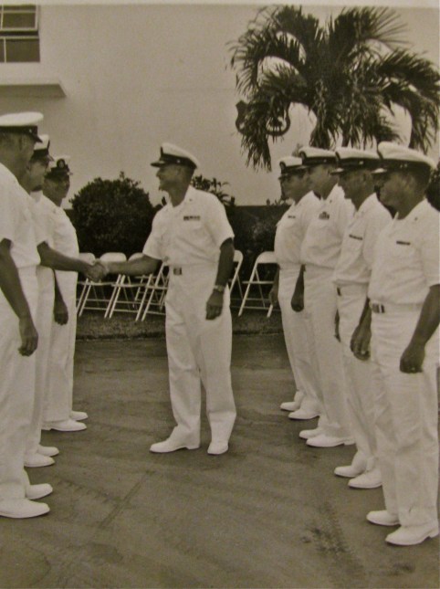 Medina inspects the sailors who worked with him in the small engine shop the Navy ran in Key West. By this time he had spent 20 years in the Navy and was retiring.