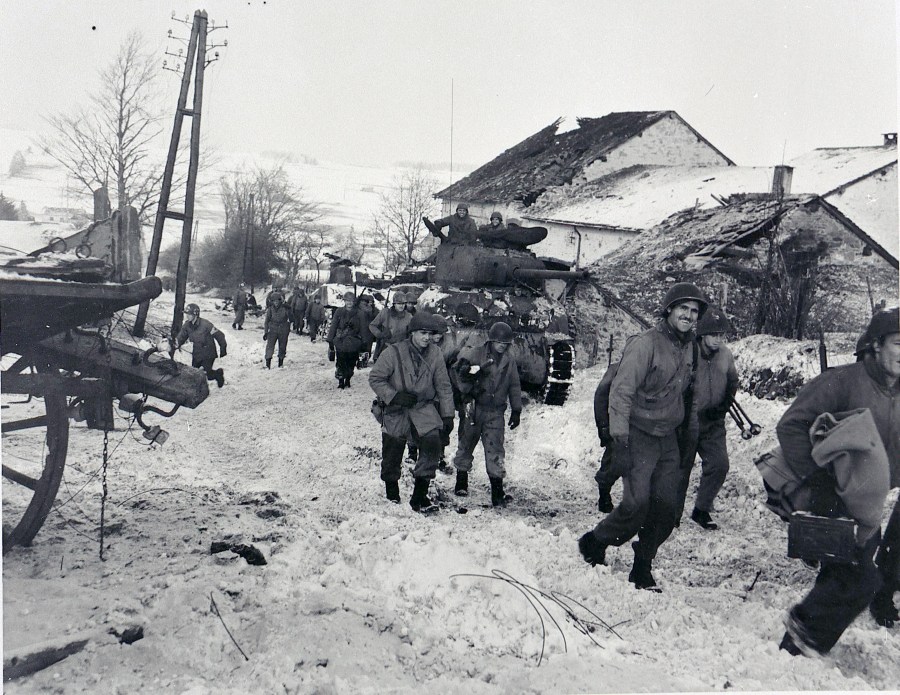  American soldiers slog through the mud and snow during the Battle of the Bulge in December 1944. It  was the coldest winer in 50 years in Europe and developed into the biggest battle on the Western Front during World War II. Photo provide