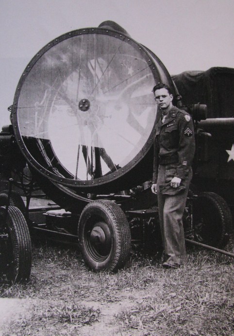 Sgt. Eddy Edwards of Port Charlotte, Fla. stands beside an aviation search light that produced 800,000,000 candle-power. He was a member of the Air Corp's 225th Anti-Aircaft Artillery Search Light Battalion in Europe during World War II. Photo provided by Eddy Edwards