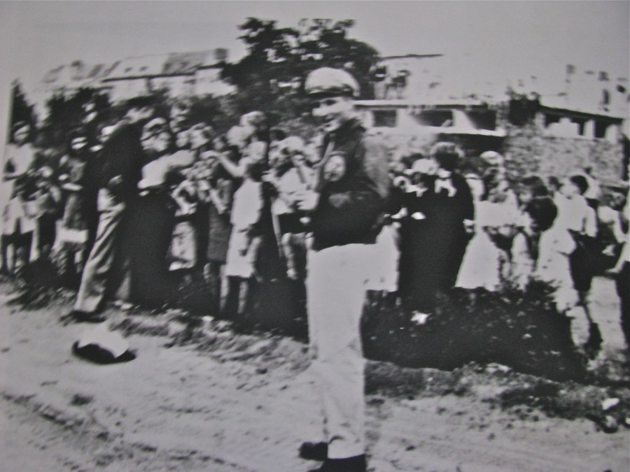 Pickering is pictured in the foreground standing in front of a group of Berlin children who received candy bars parachuted into them by his transport squadron that took part in the Berlin Air Lift in 1948. Photo provided by John Pickering