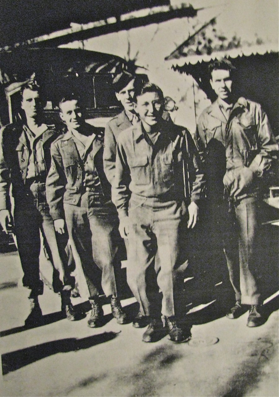 Pfc. Richard Erdley stans in the front with a smile while his buddies stand behind. They are about to check out Metz, France in June 1945 a few days after the end of World War II in Europe. Photo provided by Richard Erdley