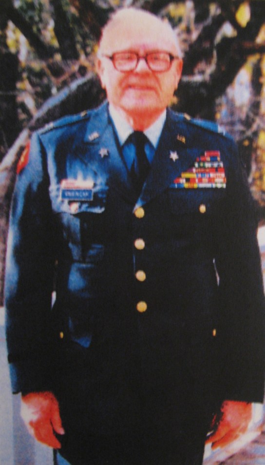 More than two decades after he retired from the service, Vnencak models his officer's uniform for his granddaughter who was doing a school project about him. Photo provided by Paul Vnencak