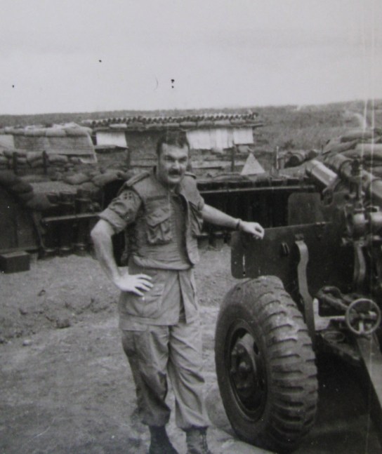  Mac Lellan stands beside an ARVIN canon in 1972 while fighting in the Central Highlands.