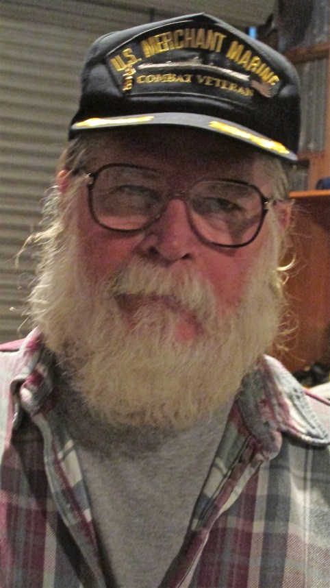  He wears his Vietnam War Merchant Marine cap at home in North Port. Sun photo by Don Moore