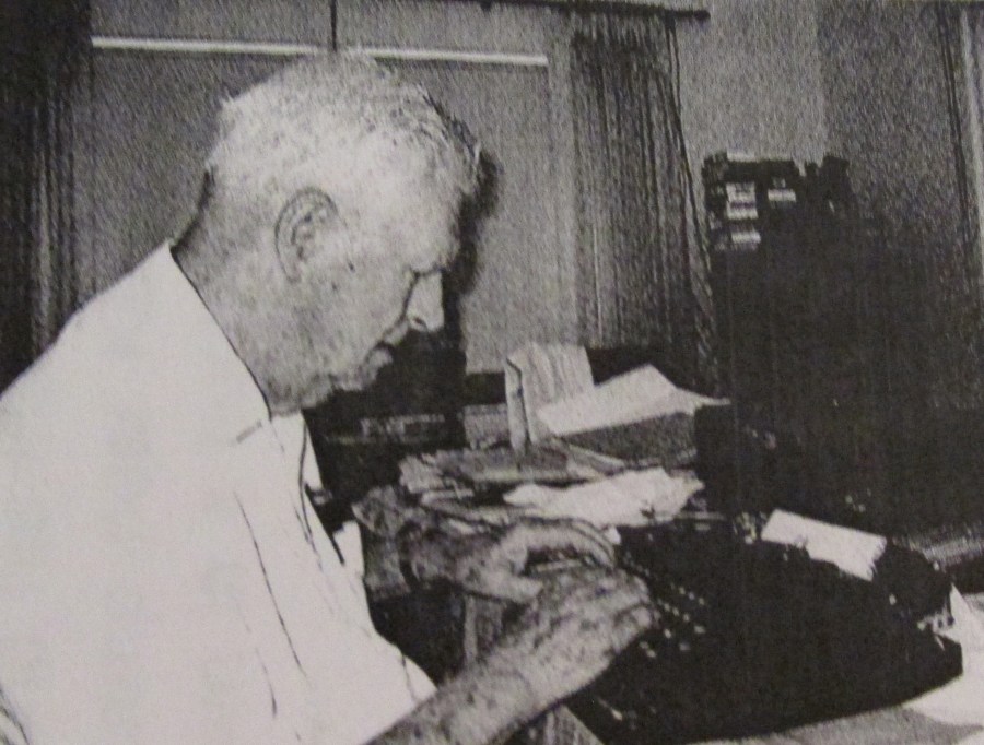 Cleveland tries out an old "Corona" portable typewriter he "liberated" from the Army Signal Corps in Europe a lifetime ago. It still works perfectly. Sun photo by Don Moore