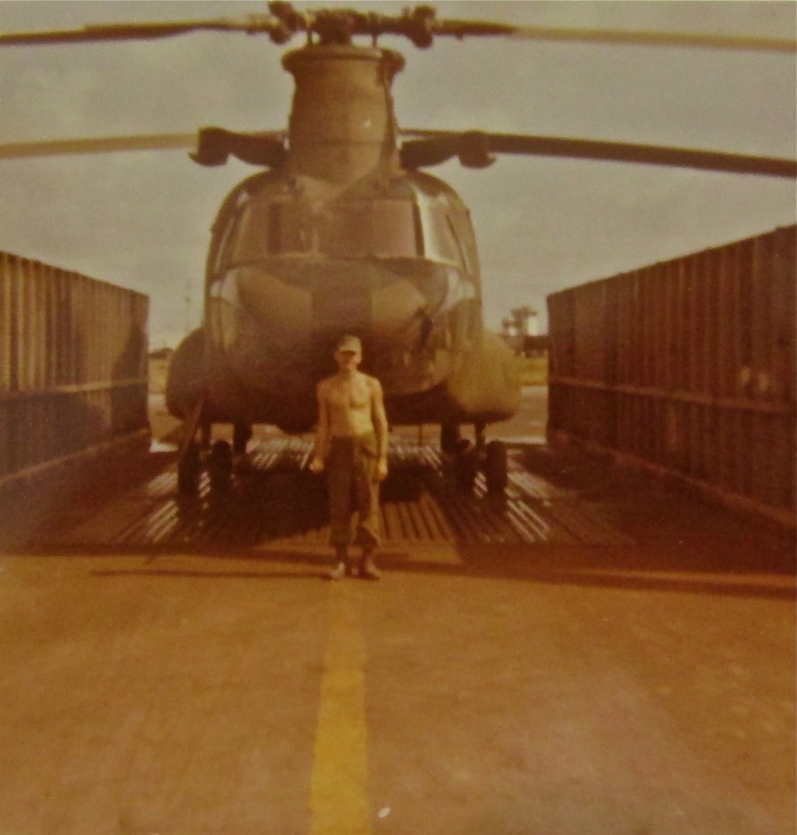 Spc. 5 Stuenkel stands in front of the Chinook CH-47 helicopter he crew-chiefed on in Vietnam in 1970. He served with the 147th Assault Support Helicopter Unit in 'Nam based in Bein Xe Moi in the Delta. Photo provided