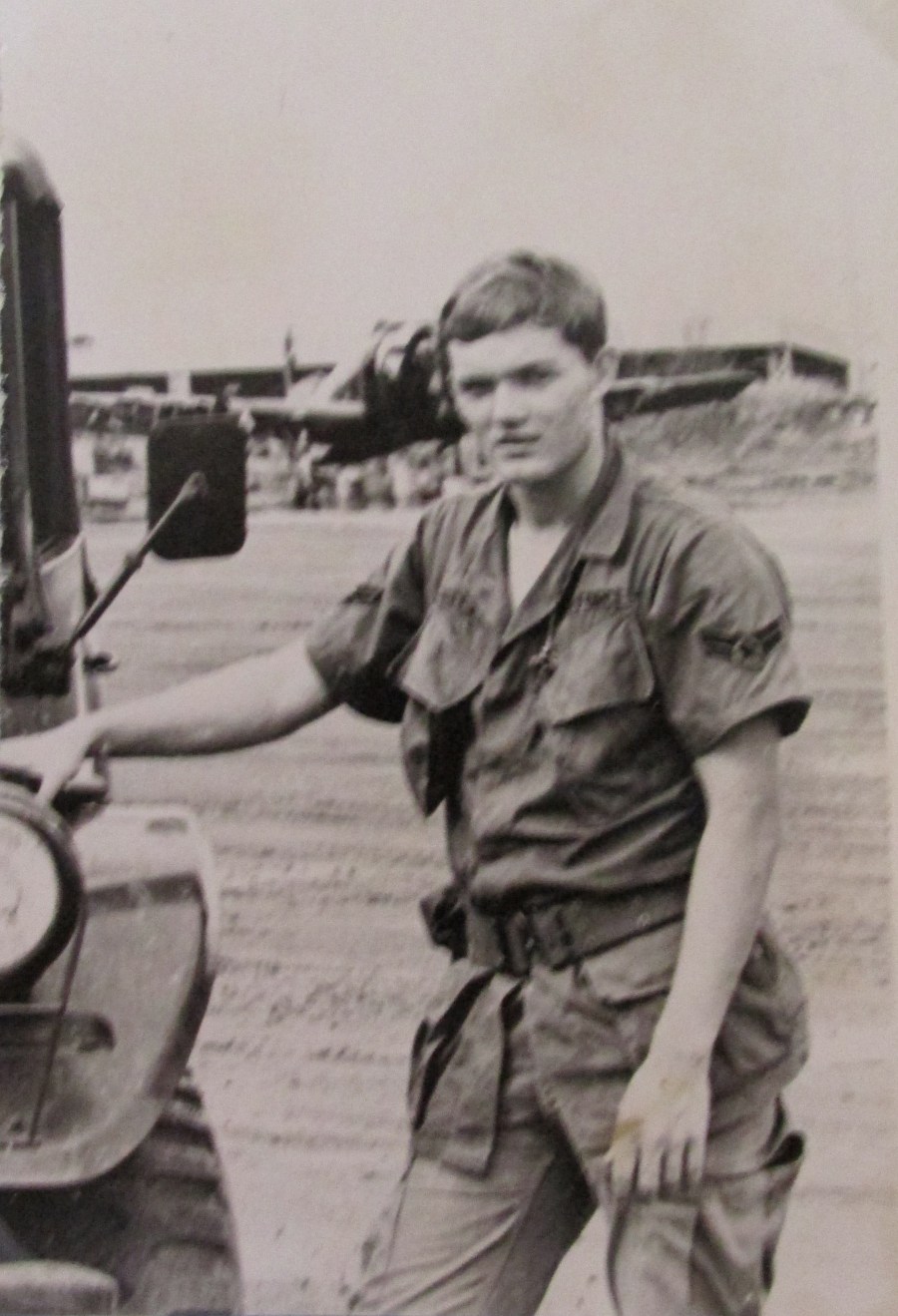 Airman Jack Freeman of Port Charlotte is pictured with his Jeep along the runway at Bien Hoa Air Force base north of Saigon in 1969 where he worked as weapons specialist. In the background is a Douglas A-1 "Skyraider." Photo provide