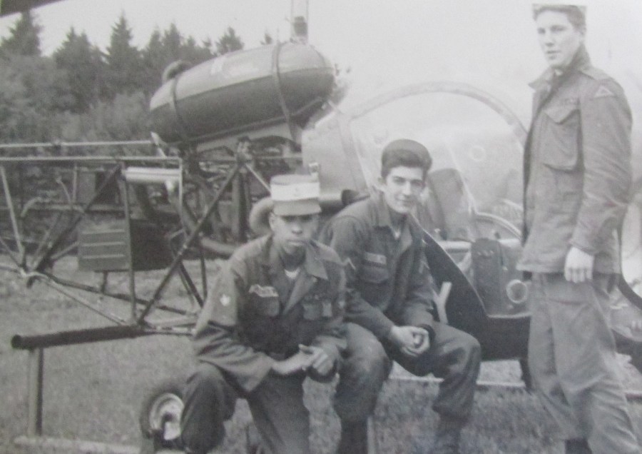 Ardolino (center) and several of his friends get their picture taken with an Army helicopter that flew into their area. Photo provided