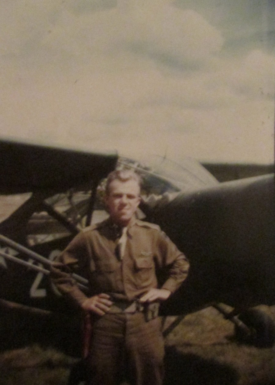 1st Lt. John Johnson stands in front of his L-4 Piper Cub somewhere in Europe during World War II. Photo provided