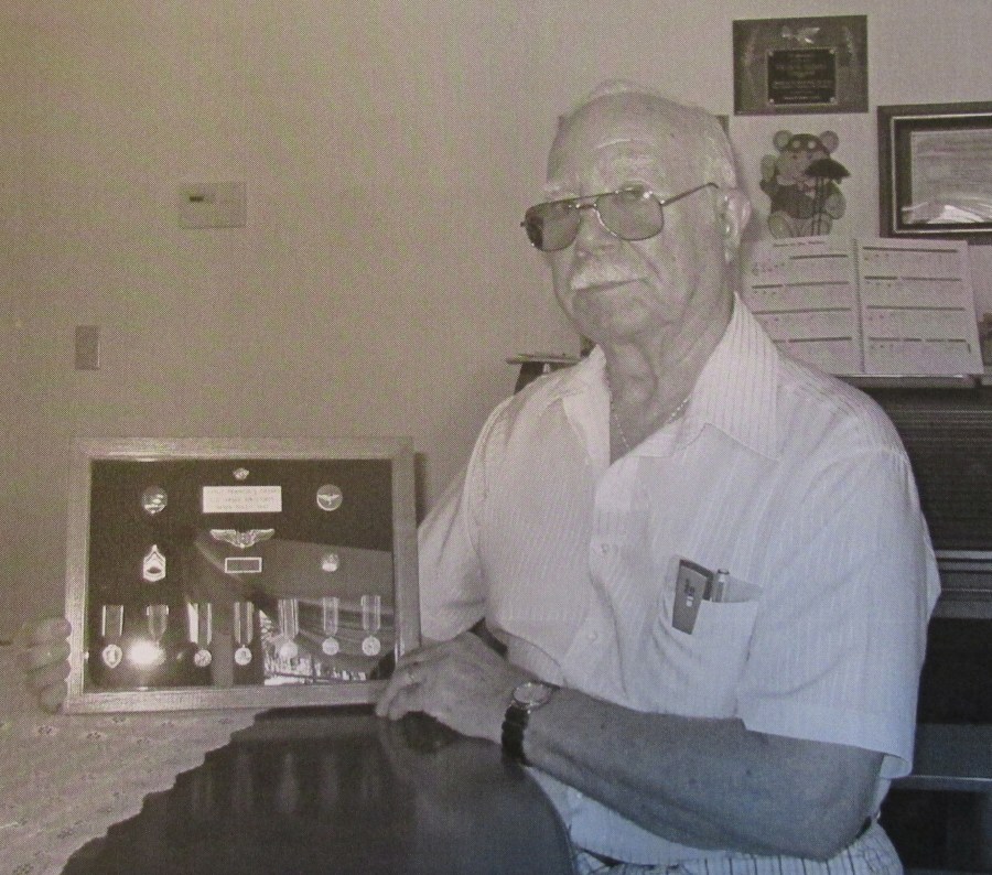  Bob Herres of Venice, Fla. holds a shadow box of medals he was awarded while serving as a gunner on a B-24 bomber during the Second World War. Sun photo by Don Moore