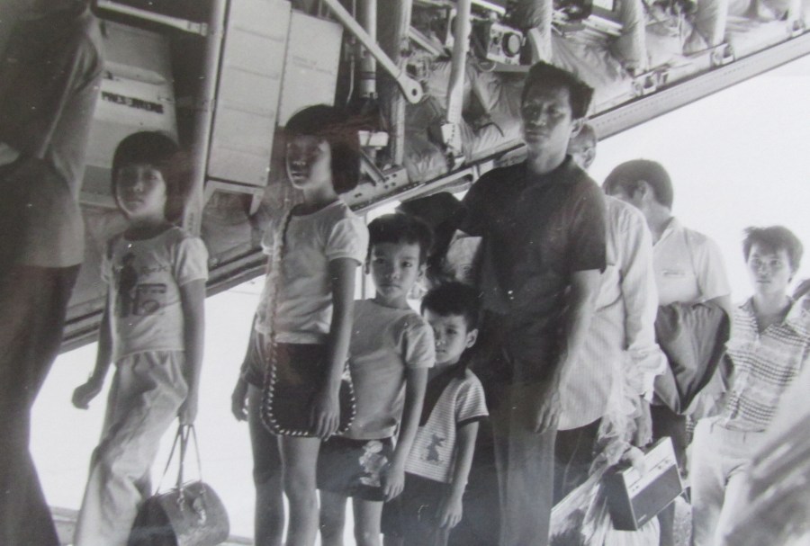 A C-130 transport plane loads Vietnam refugees aboard in April 1975 just before the fall of Saigon Photo provided