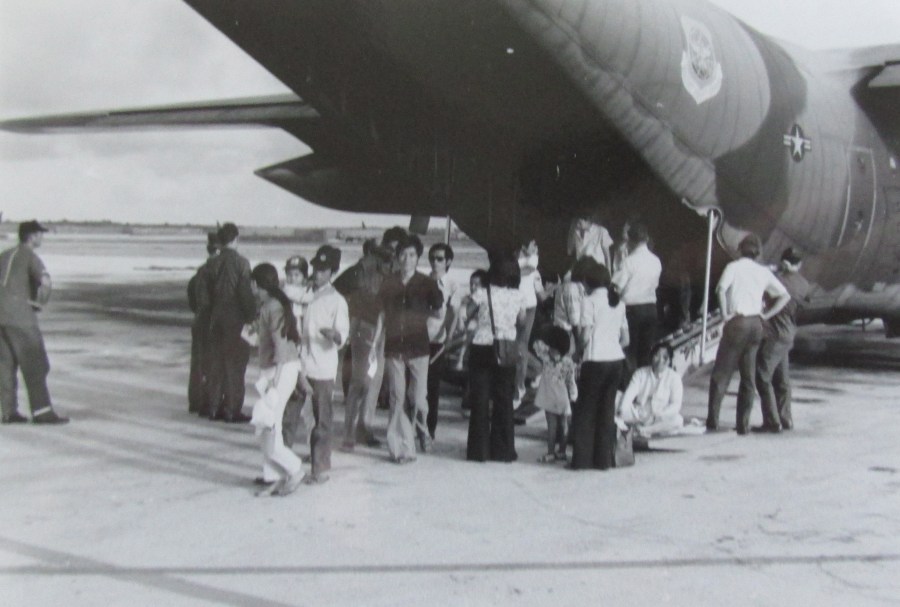 Vietnamese refugees get aboard a C-130 transport during the final days before the fall of Saigon to the North Vietnamese. Lt. Joe Comeaux was involved in flying them to safety in the Philippines. Photo provided