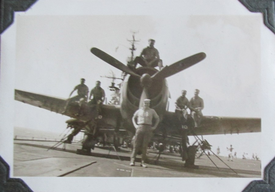  Seaman 1st Class Gene Roaf is pictured standing in front of a fighter on the deck of the carrier USS Bennington possibly off Iwo Jima during World War II. He was a plane captain and maintained a Corsair fighter for a Marine pilot. Photo provided