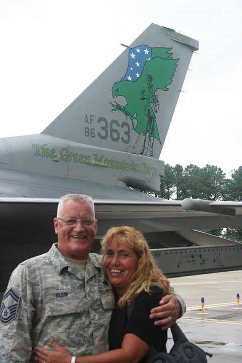  Sgt. Klein and Sharon, his wife, embrace next to an F-16 fighter jet about the time the 158th Fighter Wing was deactivated at Langley Air Fore Base in Virginia in 2013. Photo provided