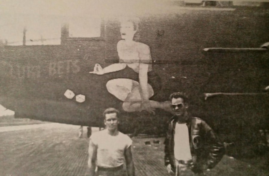 Jim McGrath and Dick Ramstack, another B-25 pilot in his unit, stand beside the B-25 Mitchell bomber McGrath flew built by North American Avation. The nose art was taken from an Esquire magazine pinup of the day. The plane was named for his wife, Betty . Photo provided by Jim McGrath