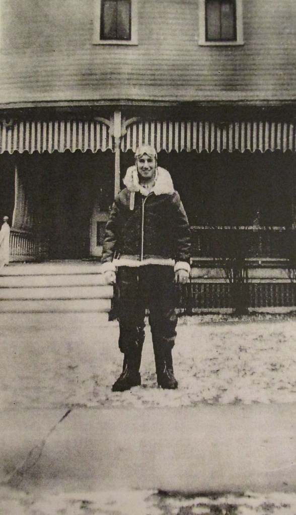 Butler stands in front of his Pennsylvania  home during the war in his sheep skin lined flying suit. Photo provided