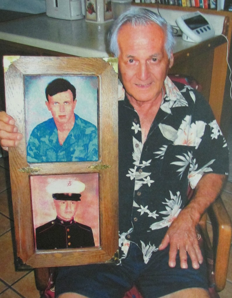 Stanley Firoini of Port Charlotte holds photos of his two sons, William and Gary, when they served in the U.S. Marine Corps during the Vietnam era. Standly was a deckhand on a landing craft that brought Marines ashore in the first wave during the Battle of Iwo Jima in World War II. Sun photo by Don Moore
