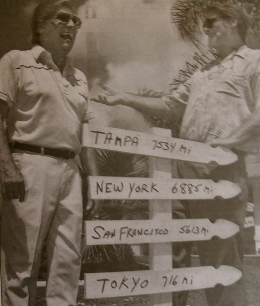 Sal Russotto of Port Charlotte, left, and Charles Wilson of Tampa, look at a sign that gives soldiers the distances from Korea to Tampa, New York, San Francisco and Tokyo. Sun photo by Jonathan Fredin