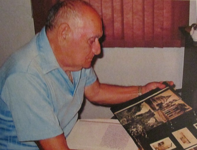 Pete Marlo looks at a scrapbook full of pictures of himself  when he served with the 62nd  Anti-aircraft Artillery Battalion  attached to Patton's 3rd Army in World War II. Sun photo by Don Moore