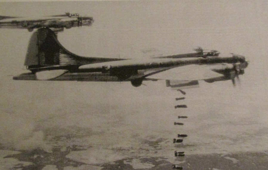 A B-17 bomber drops its bombs over German-held territory during the war. This is a homer like the one Griffith flew in. Photo provided