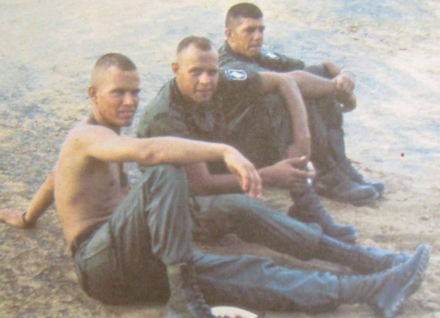 A young Capt. Carroll relaxes shirtless with a couple of buddies in Vietnam. Photo provided
