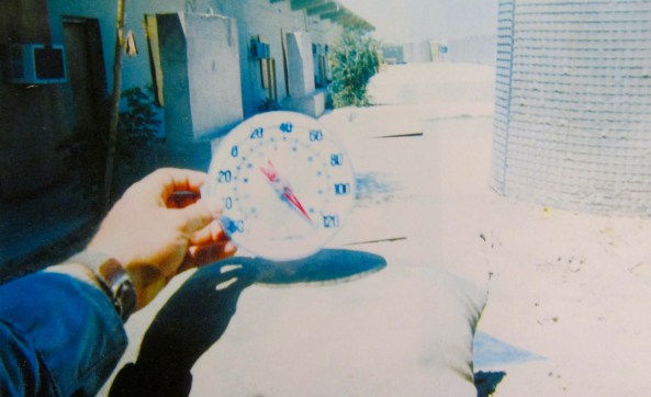 Sgt. Frey holds a thermometer that’s registering in excess of 120 degrees in August at Marine Camp Falugah where he spent a lot of his time while in Iraq. Photo by David Frey