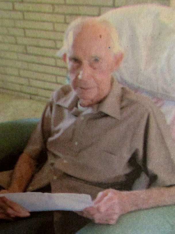 Don Platt of Englewood, Fla. reads a letter he wrote his mother, Grace, while serving in the Pacific during World War II. Sun photo by Don Moore