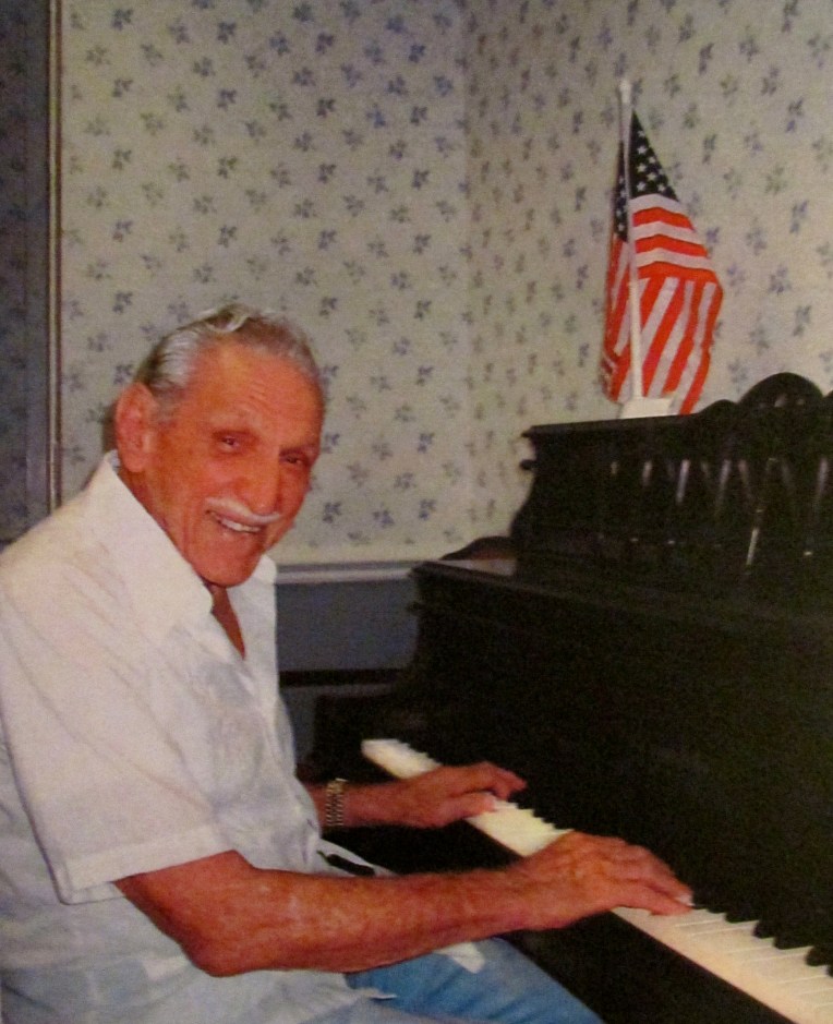 At 98, Hap Saams can still pal a mean piano. He played during the big band era of the 1930s and '40s in New York. He had a one-man nightclub routine in Miami and the Keys for decades afterwards, Here he's playing for the lunch crowd at the Royal Palm Retirement Center in Port Charlotte where he lives. Sun photo by Don Moore