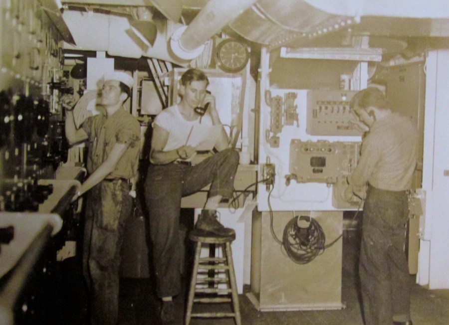 Electrician’s mate 2nd Barrow (left) works on equipment aboard the Fletcher class destroyer, USS Aulick, in the Pacific Theatre of Operation during World War II. Photo provided.