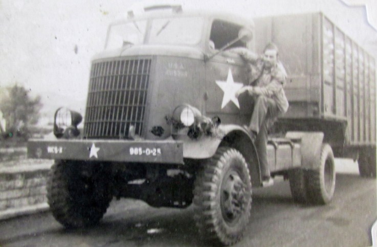 Hampton squats on the running board of his Federal-made semi-truck that had a top speed of 41 mph and went 3 miles on a gallon of gas. He drove it all over Europe with the 1st and 3rd Armies during World War II. Photo provided